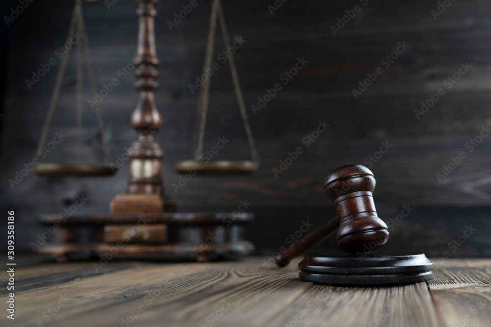 Law concept. Judge’s gavel and scale on dark background. Law concept. Judge’s gavel and scale on dark background.