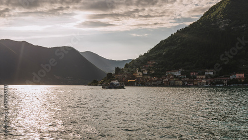 panorama view of Lake Iseo in Lombardy with water train, Italy photo