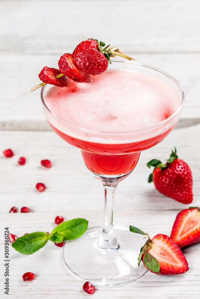 Strawberry and tequila berry cocktail shot closeup vertical Strawberry and tequila berry cocktail shot closeup vertical