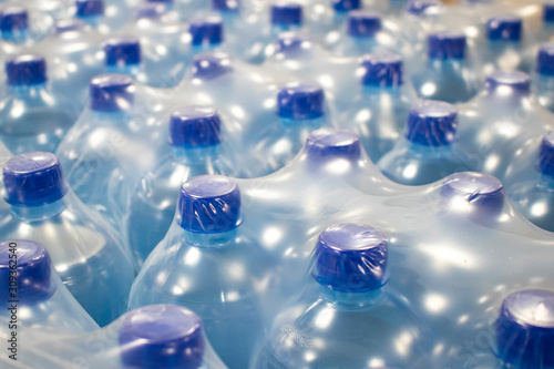 Water in plastic bottles.