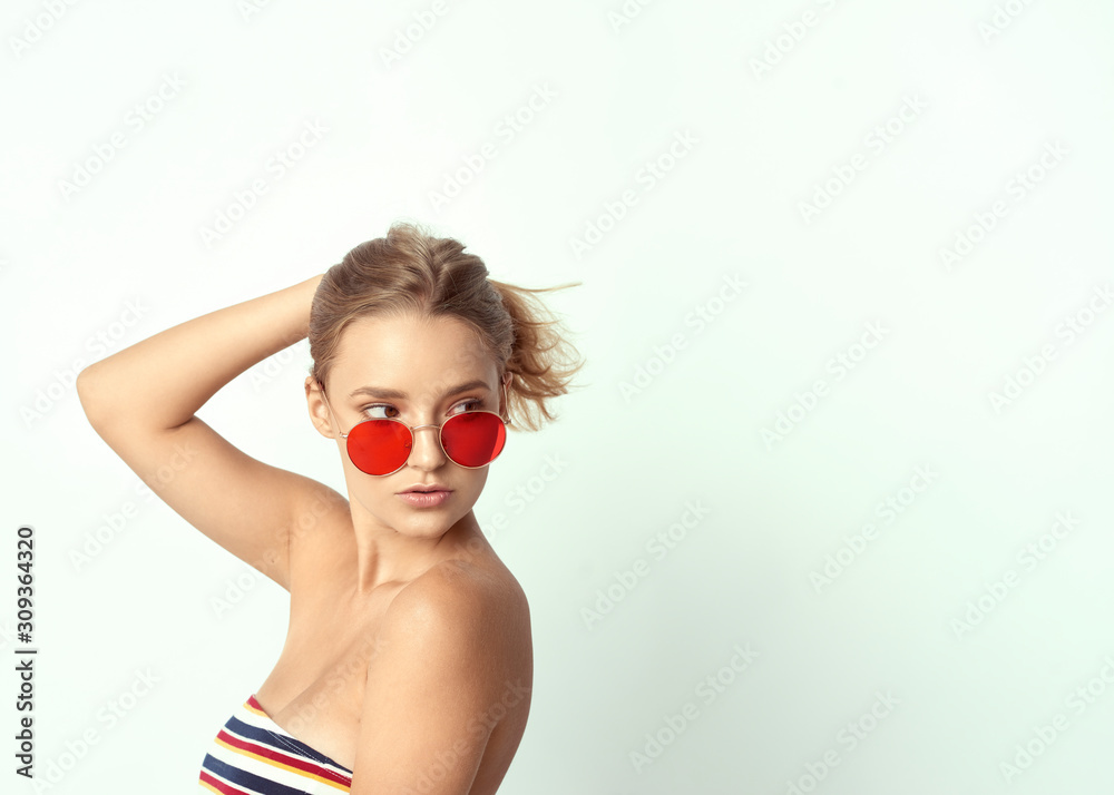young girl in glasses, beautiful and healthy skin, natural blond hair, empty background, delicate makeup young girl in glasses, beautiful and healthy skin, natural blond hair, empty background, delicate makeup