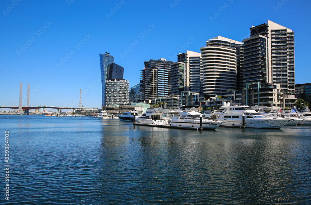 Docklands accommodation precinct in Melbourne Australia with the Bolte Bridge in the background. Docklands accommodation precinct in Melbourne Australia with the Bolte Bridge in the background.