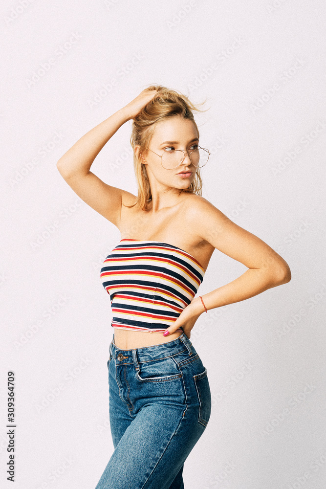 young girl in glasses, beautiful and healthy skin, natural blond hair, empty background, delicate makeup young girl in glasses, beautiful and healthy skin, natural blond hair, empty background, delicate makeup