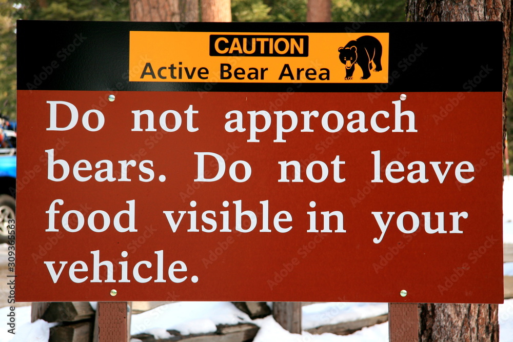 Bear danger alert warning sign in winter in Yosemite National Park, California