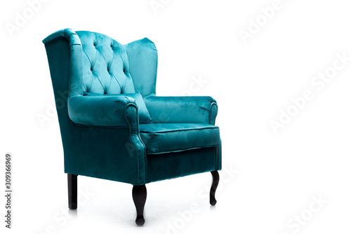 elegant velour blue armchair with pillow isolated on white photo