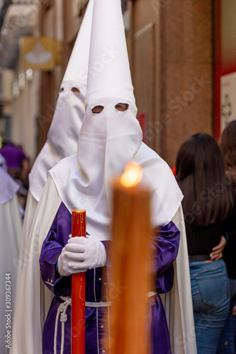 Retrato de penitente en la proceciones de semana santa en las calles de Cádiz, nazareno del amor photo