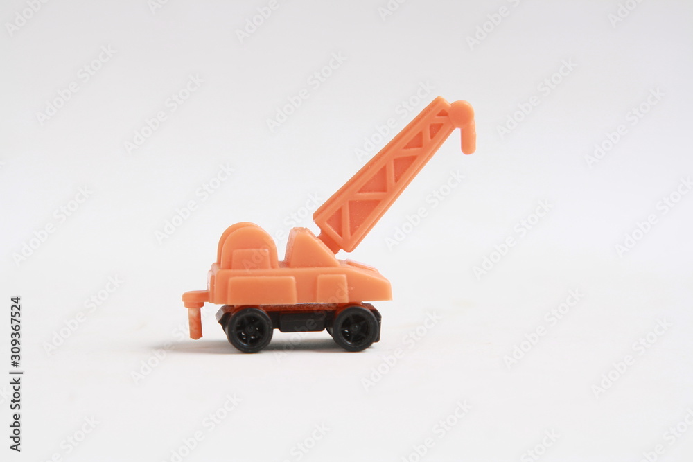 plastic toy with crane shape in color background