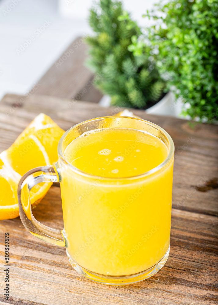 glass of fresh orange juice with fresh fruits on wooden table glass of fresh orange juice with fresh fruits on wooden table