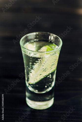close up view of fresh tequila with lime