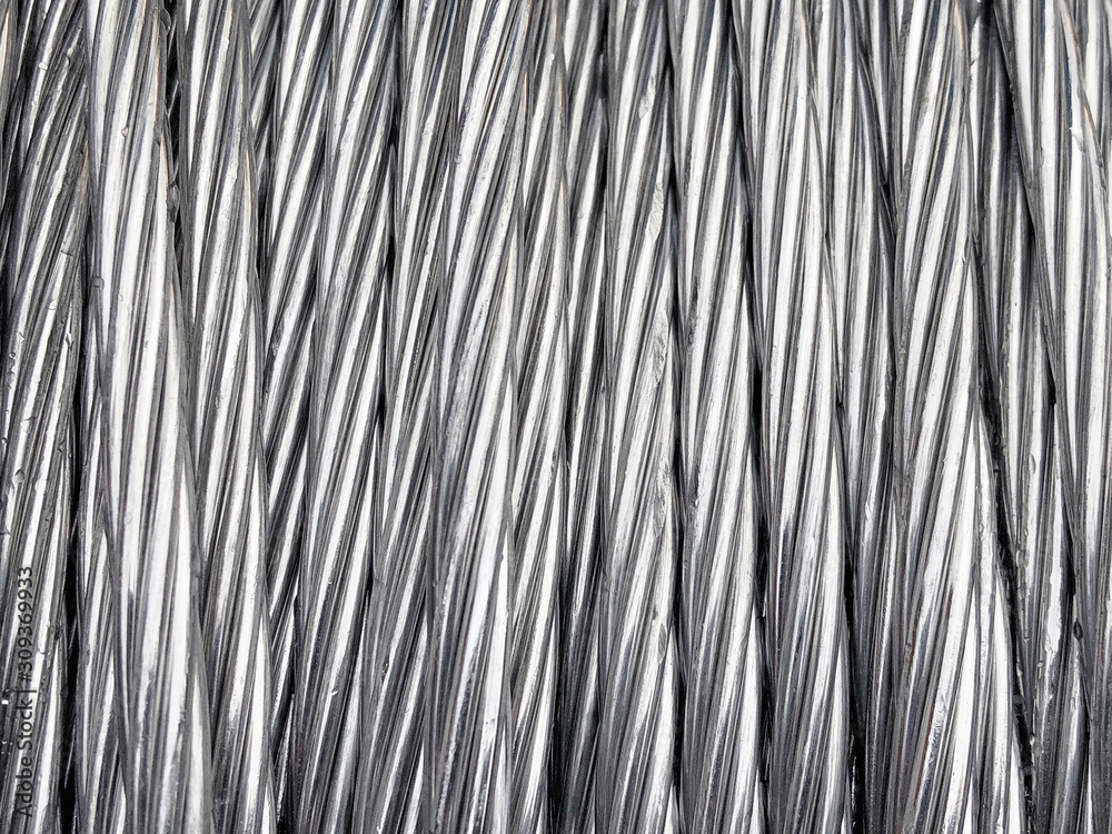 Close up of coiled metal cable industrial background Close up of coiled metal cable industrial background