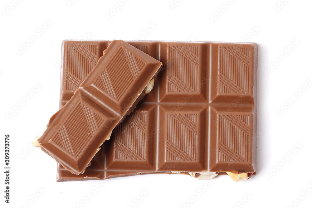 A bar and pieces of milk chocolate isolated on a white background. top view A bar and pieces of milk chocolate isolated on a white background. top view