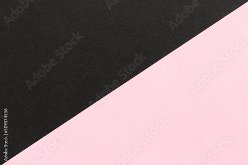 Empty black and pink diagonal paper background. Two color texture with space for text. Abstract template for poster or gift card