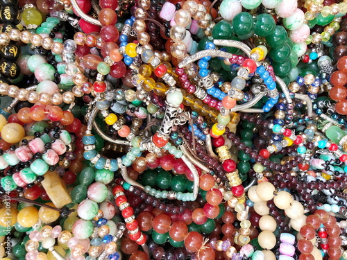 Handmade colorful bracelets from natural stones for sale in a local market 