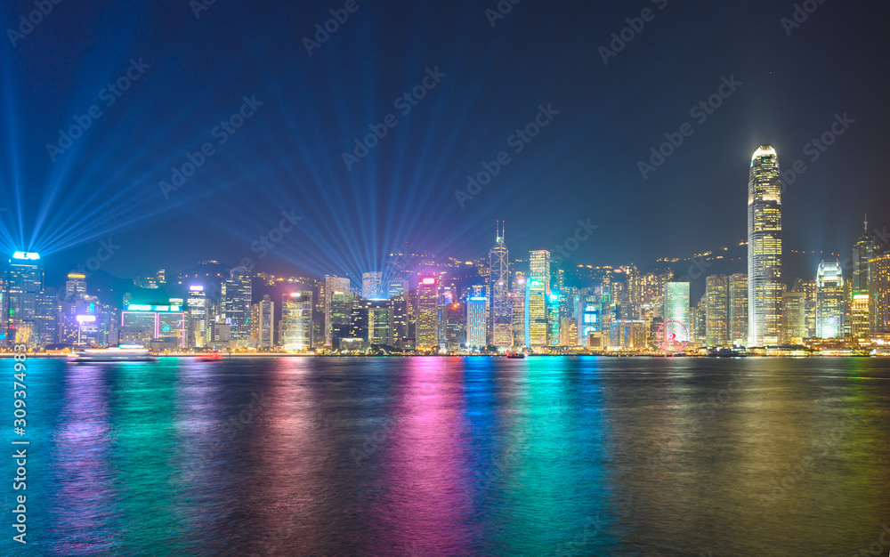 Light show at Victoria Harbour Hong Kong .