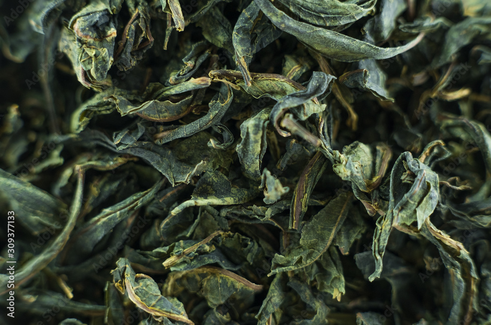 Close-up - collection of dried green tea leaves .Top view. Macro photo. Close-up - collection of dried green tea leaves .Top view. Macro photo.