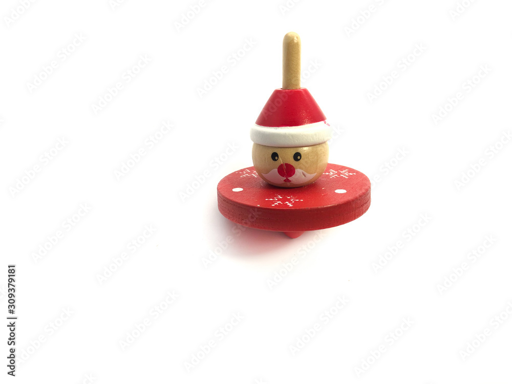 Whirligig isolated on a white background. Red yule in the form of Santa Claus. Wooden toy for children. 