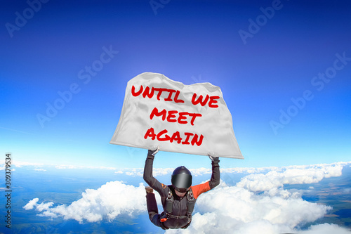 Until we meet again. Flag in skydiving. People in free fall.Teampleat skydiver. Extreme sport.