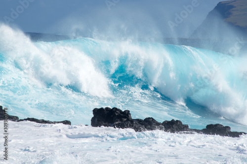 The waves of the ocean beat violently along the coasts of Easter Island, Chile