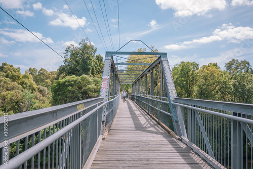 Main Yarra trail on steel bridge over the Yarra River in Victoria, Australia.