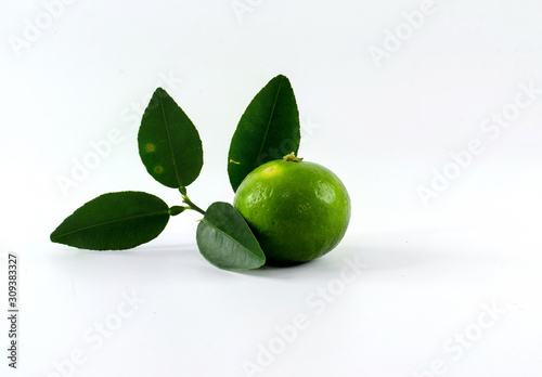 lime with leaves isolated on white background