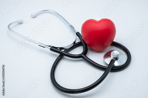 Red heart and medical stethoscope. Close up. Placed on the table with space to put text. Heart health concept Health insurance. World health day. Human health that needs to be examined and treated.