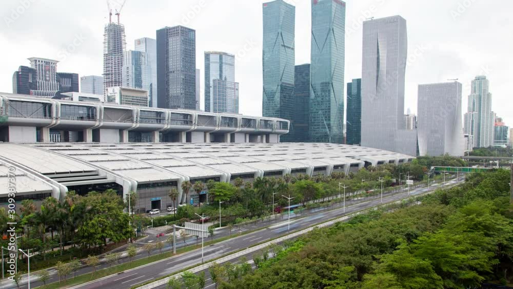 Shenzhen central business district aerial skyline panorama timelapse pan up