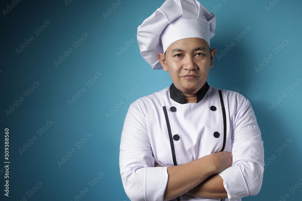 Happy Proud Asian Chef Smiling at Camera With Crossed Arms Happy Proud Asian Chef Smiling at Camera With Crossed Arms