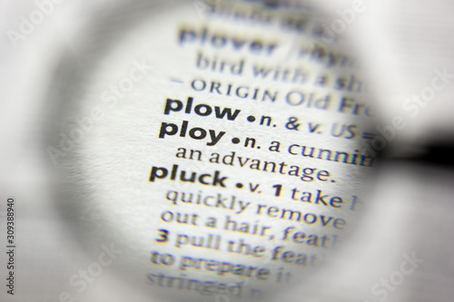 фотографія The word or phrase Ploy in a dictionary.
