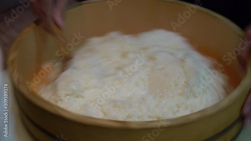 making sushi rice in wooden pot photo