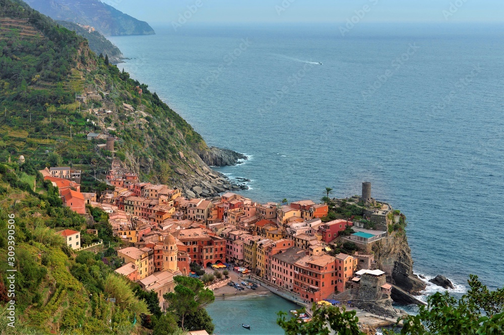 Beautiful ligurian costline with panoramic view of Vernazza, one of the villages in Cinque Terre at the National Park, La Spezia, Italy. Sea and mountains scenery.