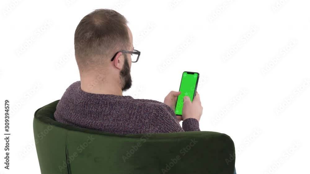 Man Using Mobile Back View Back view of a young man using cellphone. Modern gadget usage concept ...