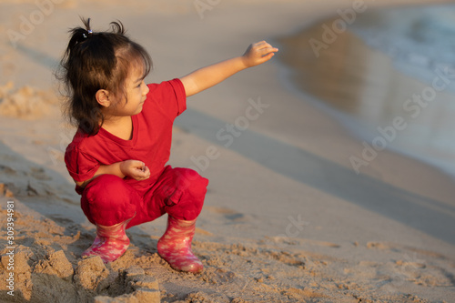 Girl playing sand on the beach-5