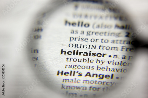 The word or phrase Hellraiser in a dictionary. photo