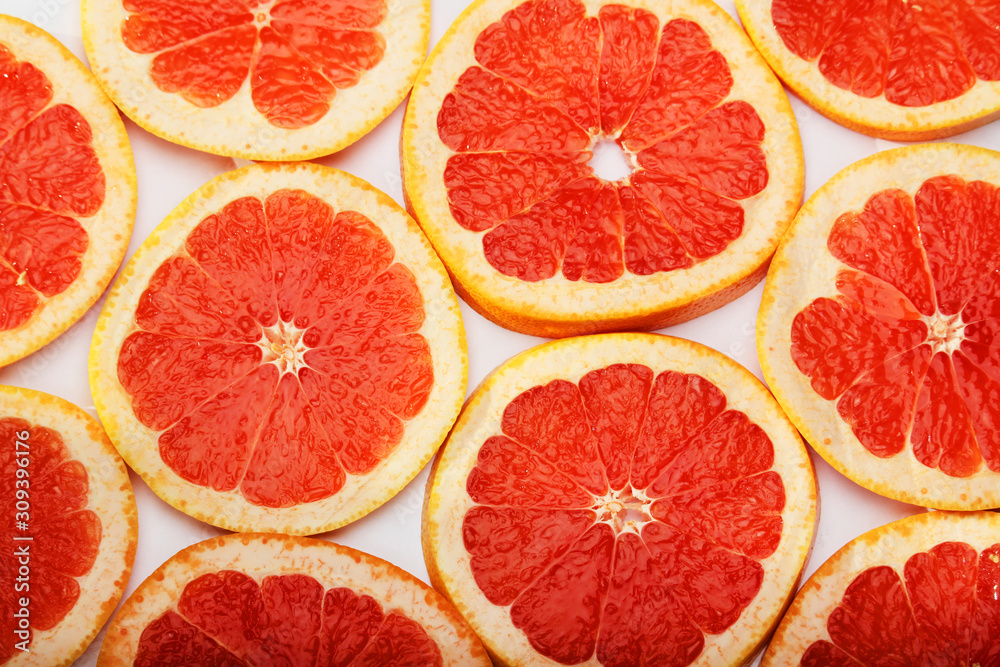 Background formed with sliced grapefruits Background formed with sliced grapefruits