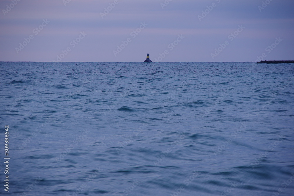 Obraz premium Lighthouse at sea