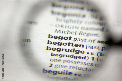 The word or phrase Begotten in a dictionary. photo