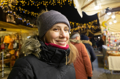 Young woman looking for presents on christmas fair © skumer