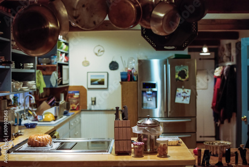 A Kitchen in a Rustic Home with Hanging Pots and Pans