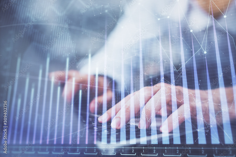 Forex graph with businessman typing on computer in office on background. Concept of analysis. Double exposure. Forex graph with businessman typing on computer in office on background. Concept of analysis. Double exposure.