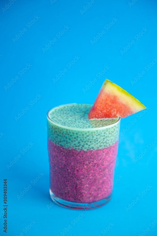 Glass of black chia pudding with watermelon taste Glass of black chia pudding with watermelon taste