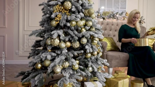 Merry Christmas. Christmas tree decorated with lights, Christmas interior background. Christmas tree with white and black balls.