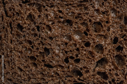 Sliced rye bread texture. Flat lay, top view, close-up