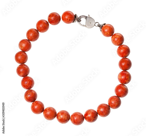 Fotografija necklace from polished red coral balls isolated
