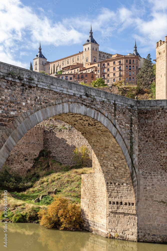 view of the Alcázar of Toledo  across Alcántara Bridge (Trajan's Bridge at Alcantara)