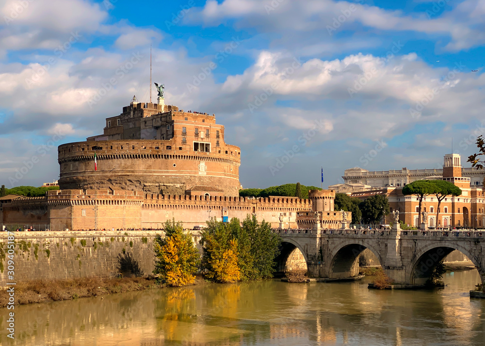 The mausoleum of Hadrian, known as Castel Sant'Angelo, with the bridge over the Tiber river on a sunny day in Rome