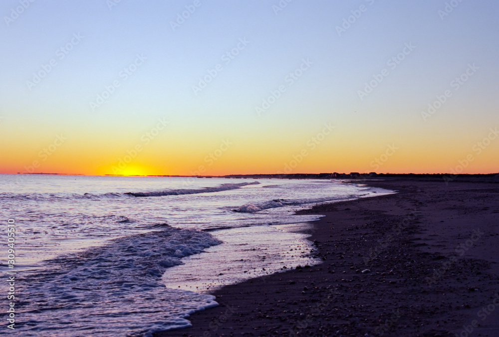 Yellow and Orange Sunrise Over a Cape Cod Beach