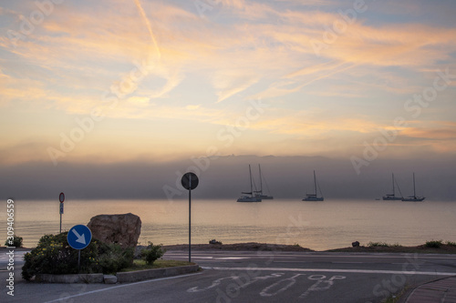 Road and bay at dawn, Cannigione, Sardinia, Italy photo