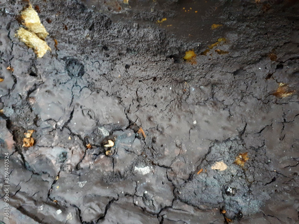 Obraz premium close-up of a decorative wall made of concrete, with a characteristic rough porous texture, abstract dark and light stains