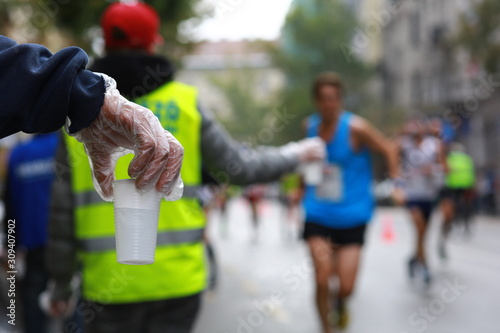 Water station help for runners in a city marathon
