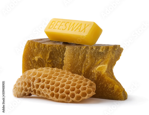 How to get natural organic beeswax. Pieces of organic beeswax on a white background. The use of beeswax in apitherapy. Production Ingredient for Medical and Cosmetics. photo